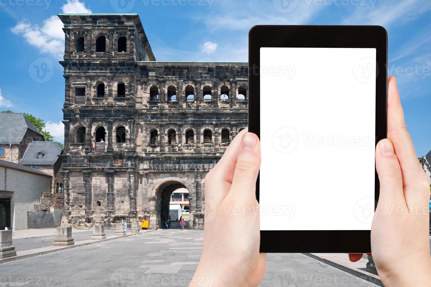 tourist photographs Porta Nigra in Trier, Germany photo