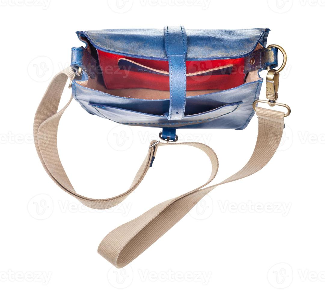 top view of empty blue handbag with textile strap photo