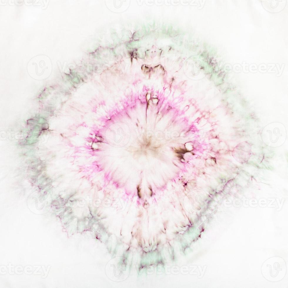 abstract stain in tie-dye batik on white silk photo