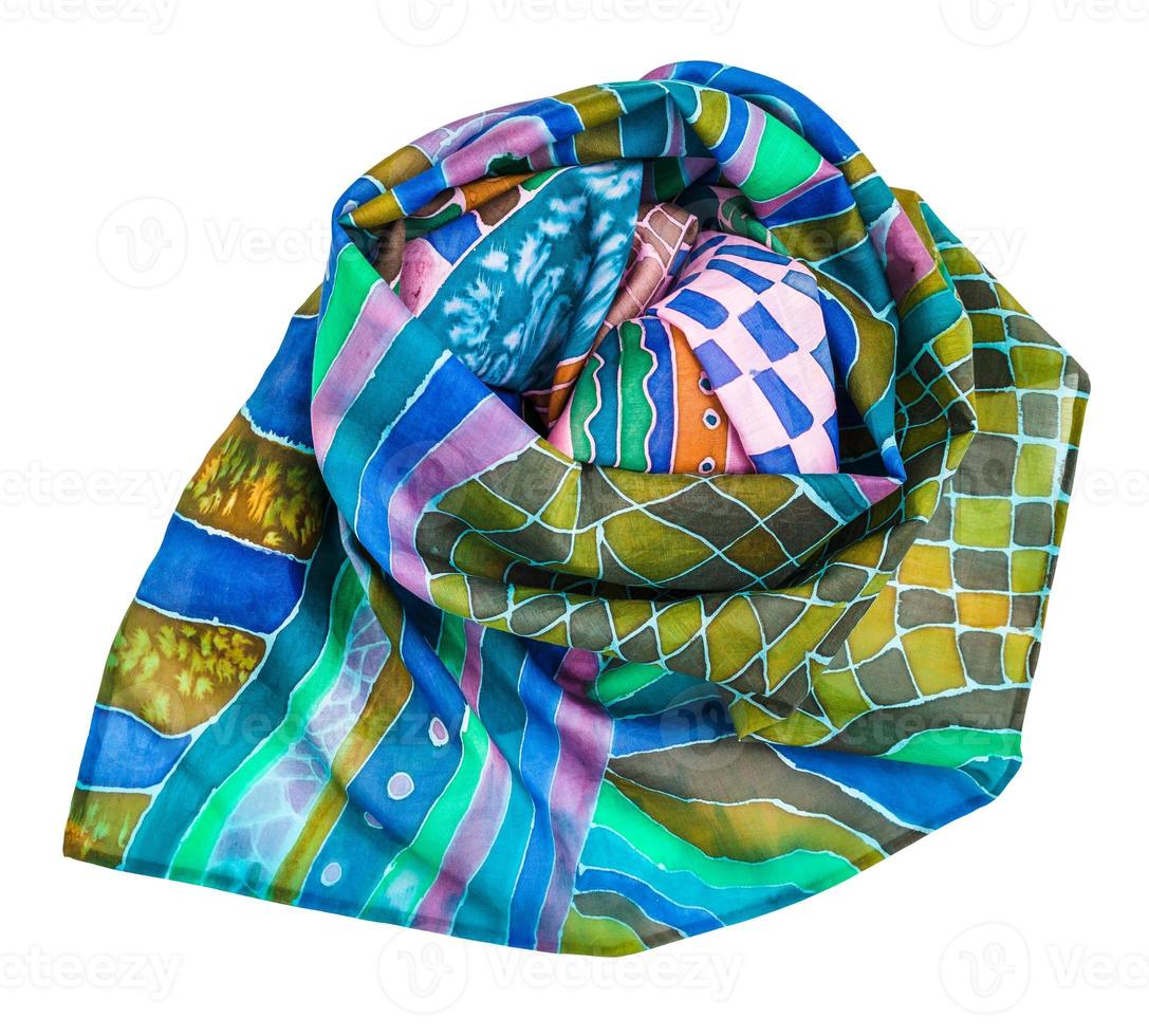 rolled scarf painted in batik technique isolated photo