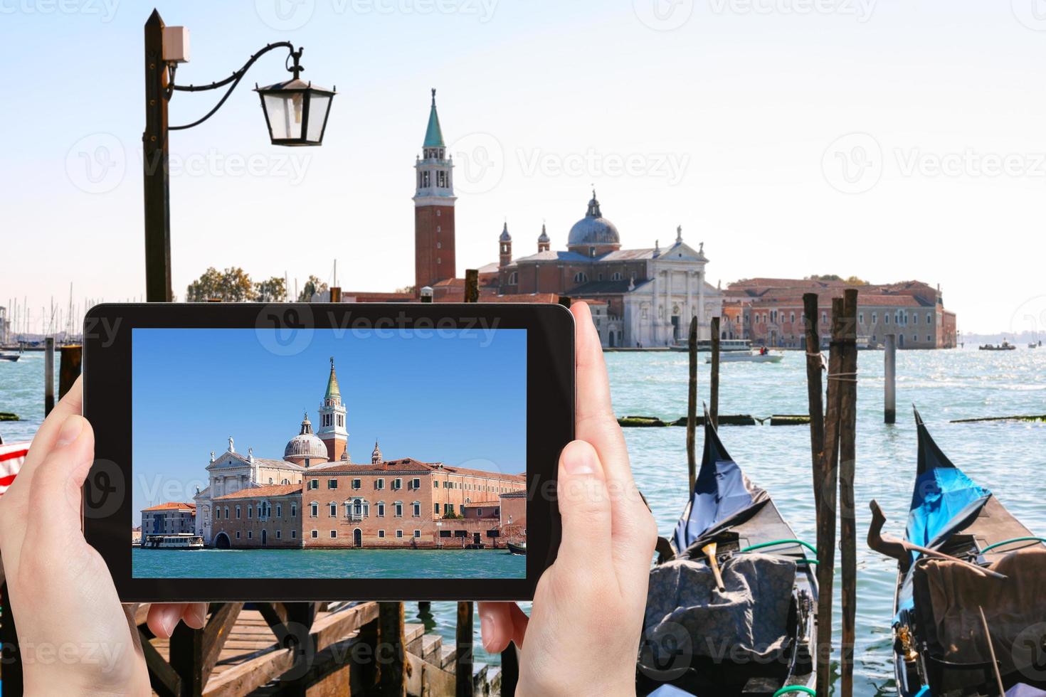 tourist photographs San Giorgio Maggiore in Venice photo