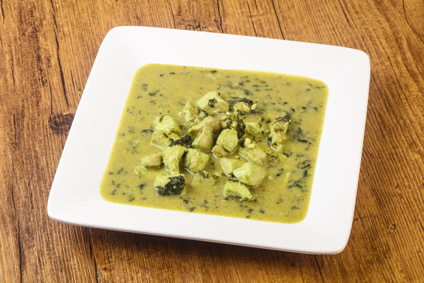 Green Curry on wood photo