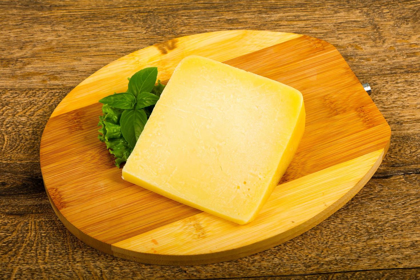 Parmesan cheese on wood photo