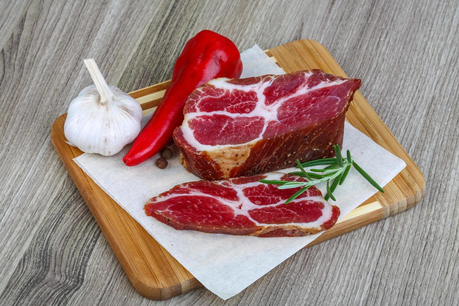 Chuck steak on wood photo