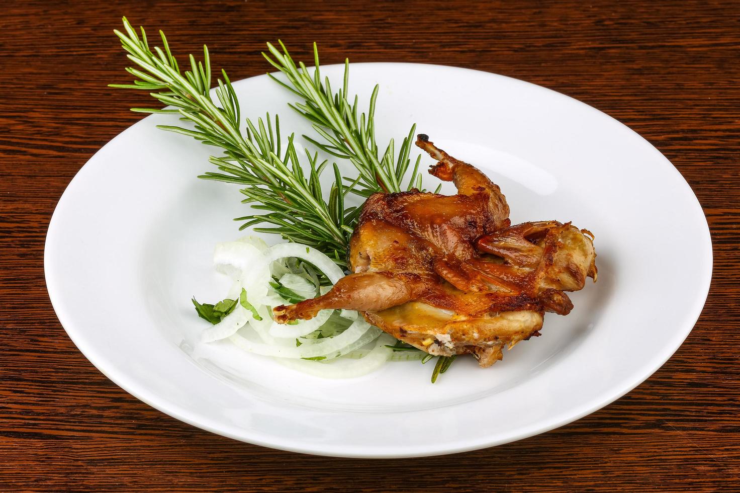 Grilled quail on wood photo