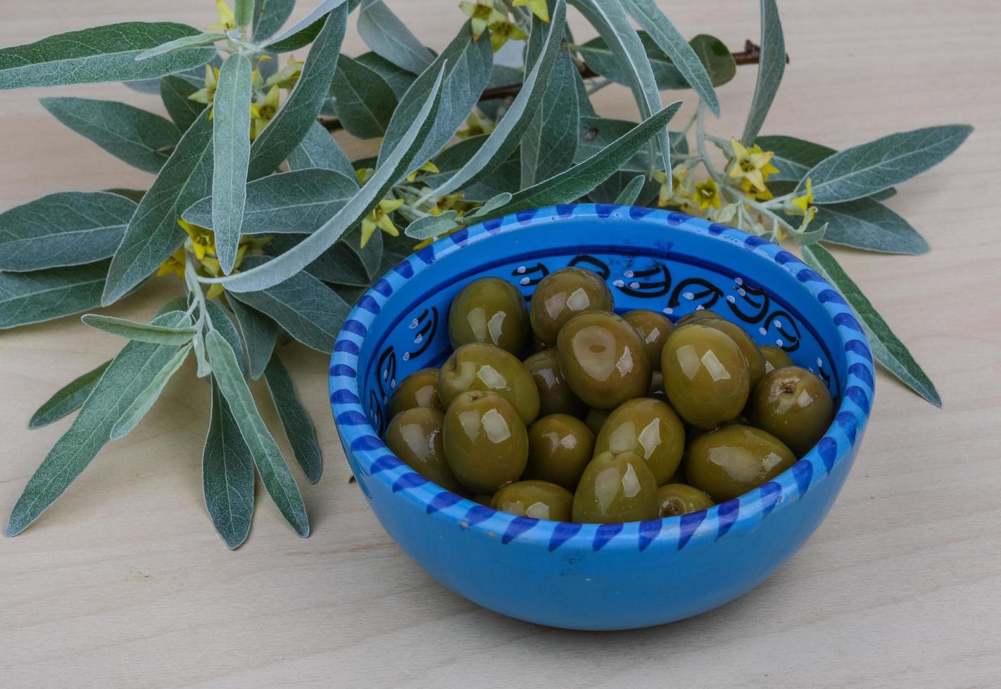 Green olives dish 12783443 Stock Photo at Vecteezy
