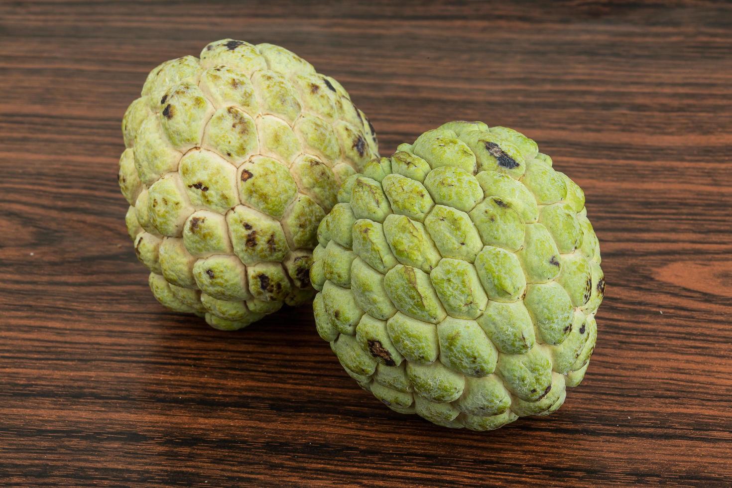 Custard apple on wood photo