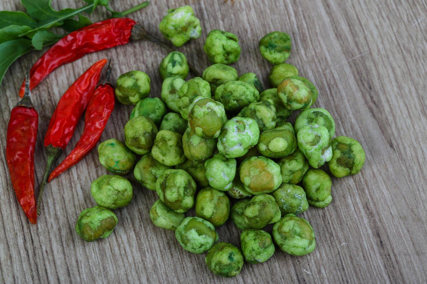 Wasabi peas on wood photo