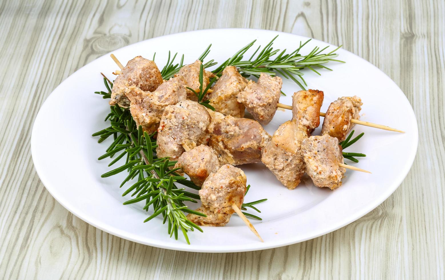 Chicken skewers on plate photo