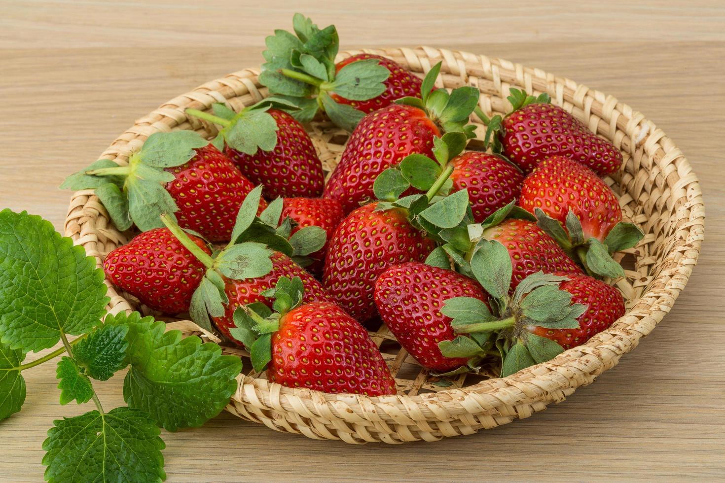 Fresh strawberry on wood photo