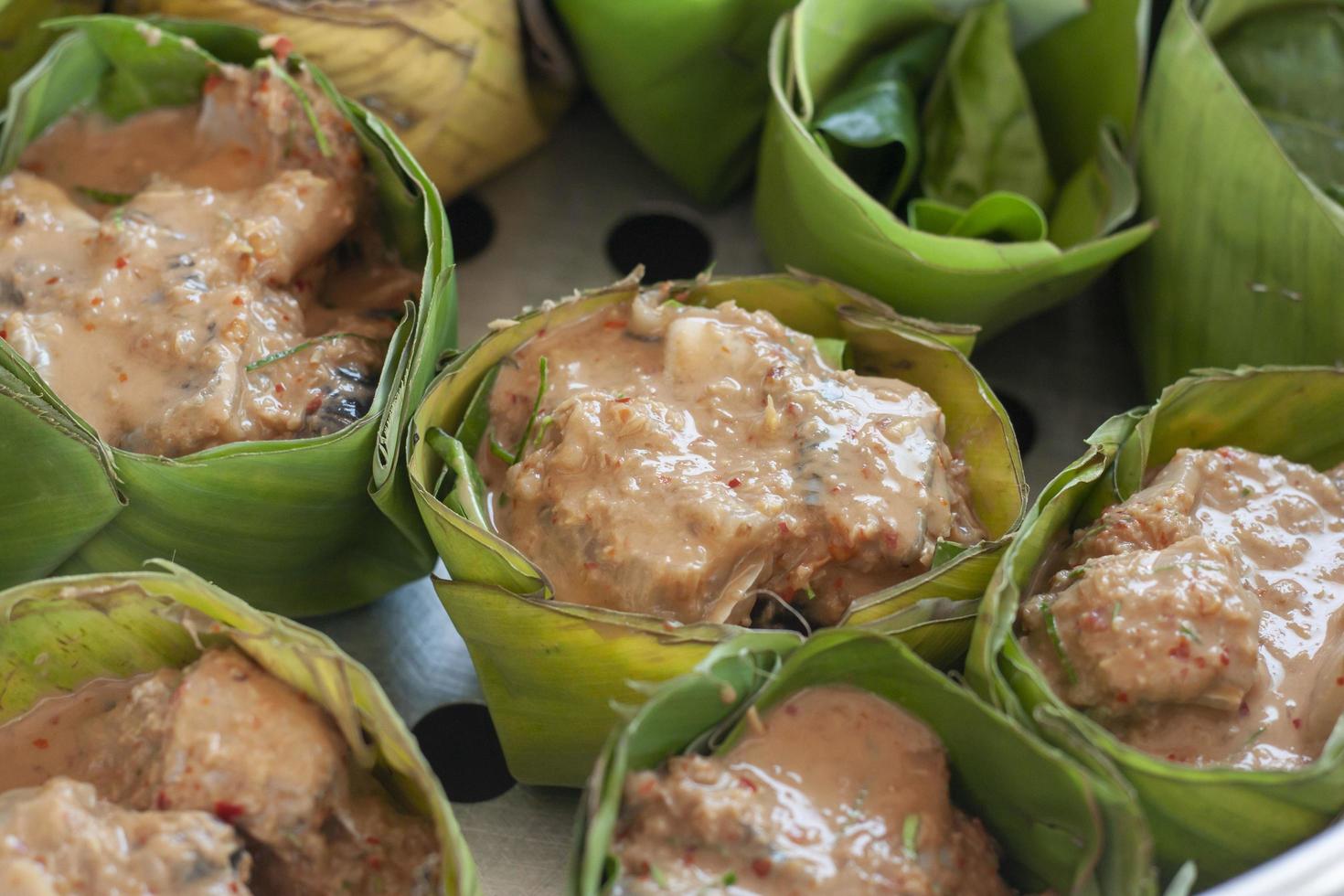 Raw Thai Steamed Fish Curry Thai people call Homok prepare for steaming. photo