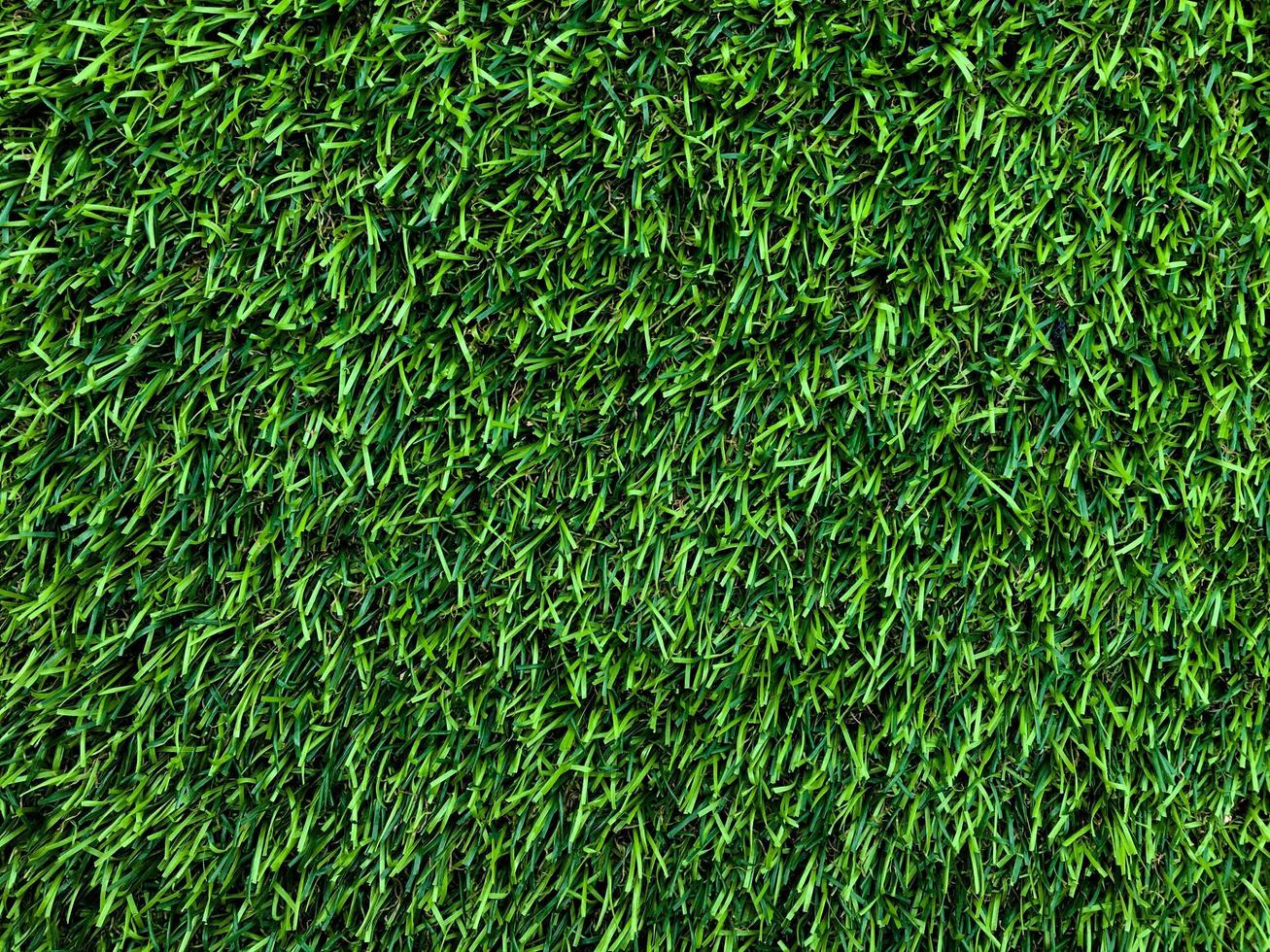 Modern green lawn texture background. Wallpaper for work and design. photo