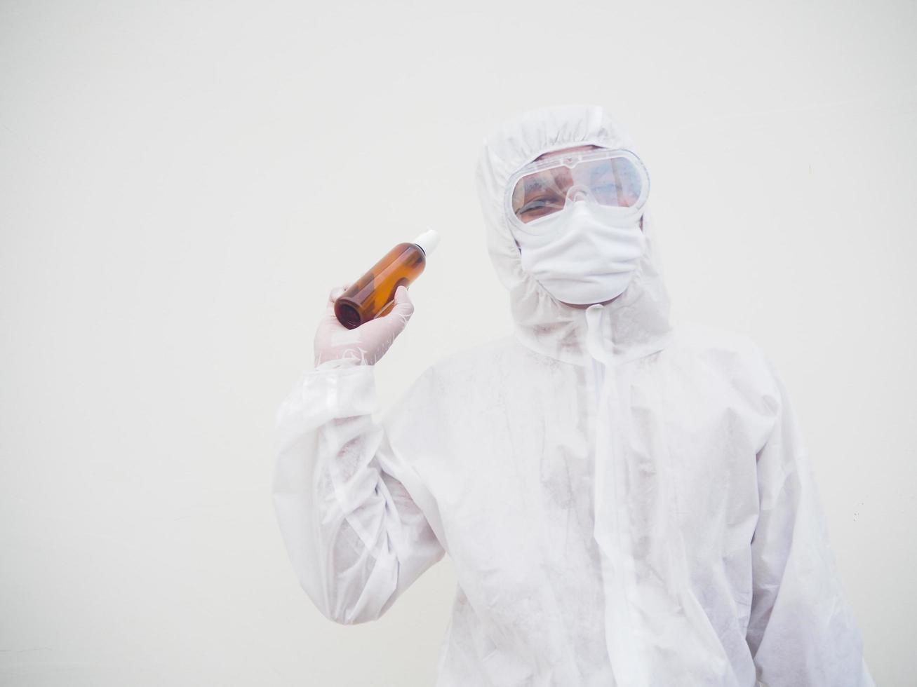 Portrait of doctor or scientist in PPE suite uniform holding plastic bottle with skin care product. COVID-19 concept isolated white background photo