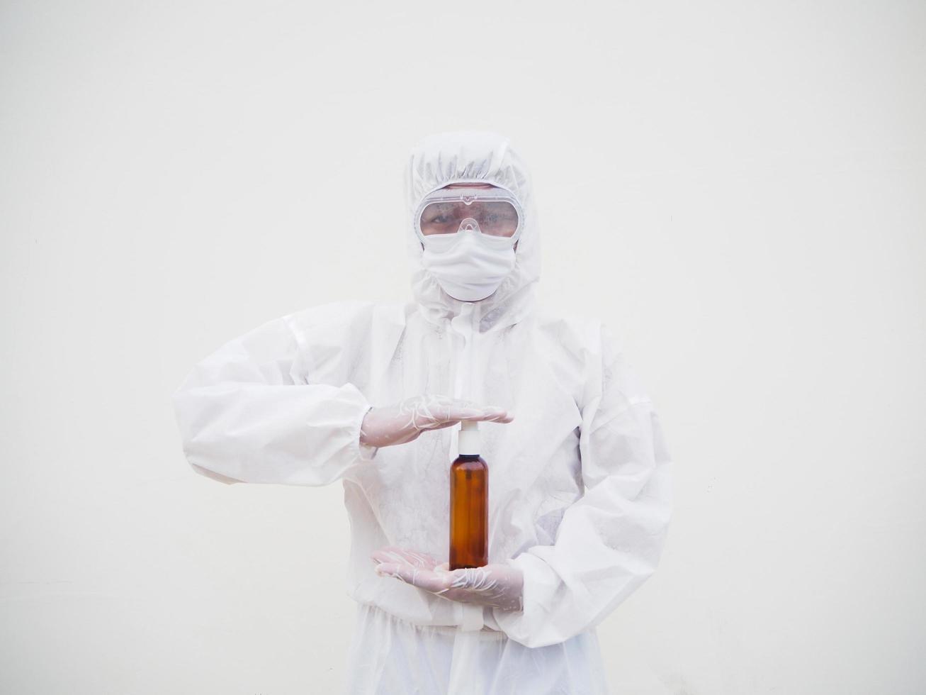 Portrait of doctor or scientist in PPE suite uniform holding plastic bottle with skin care product. COVID-19 concept isolated white background photo