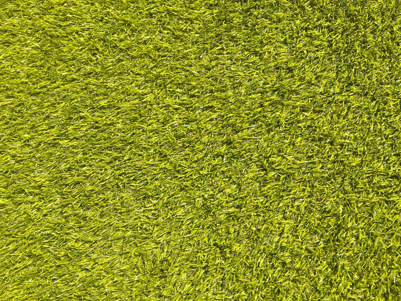 Artificial green lawn backyard for background. Texture for design photo