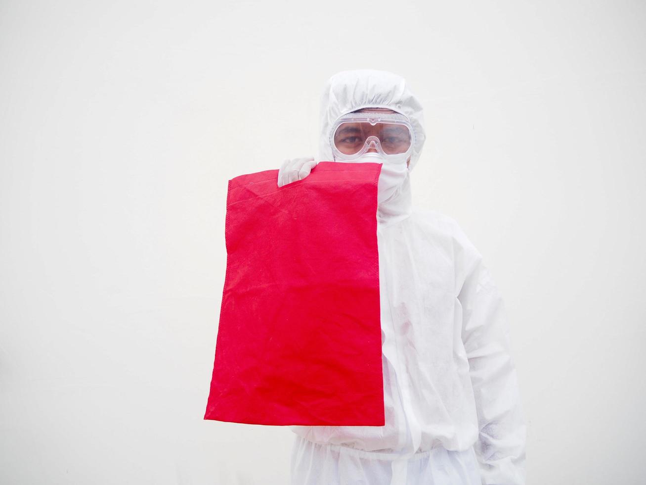 Asian doctor or scientist in PPE suite uniform. holding bag canvas fabric for mockup or for your design. coronavirus or COVID-19 concept isolated white background photo