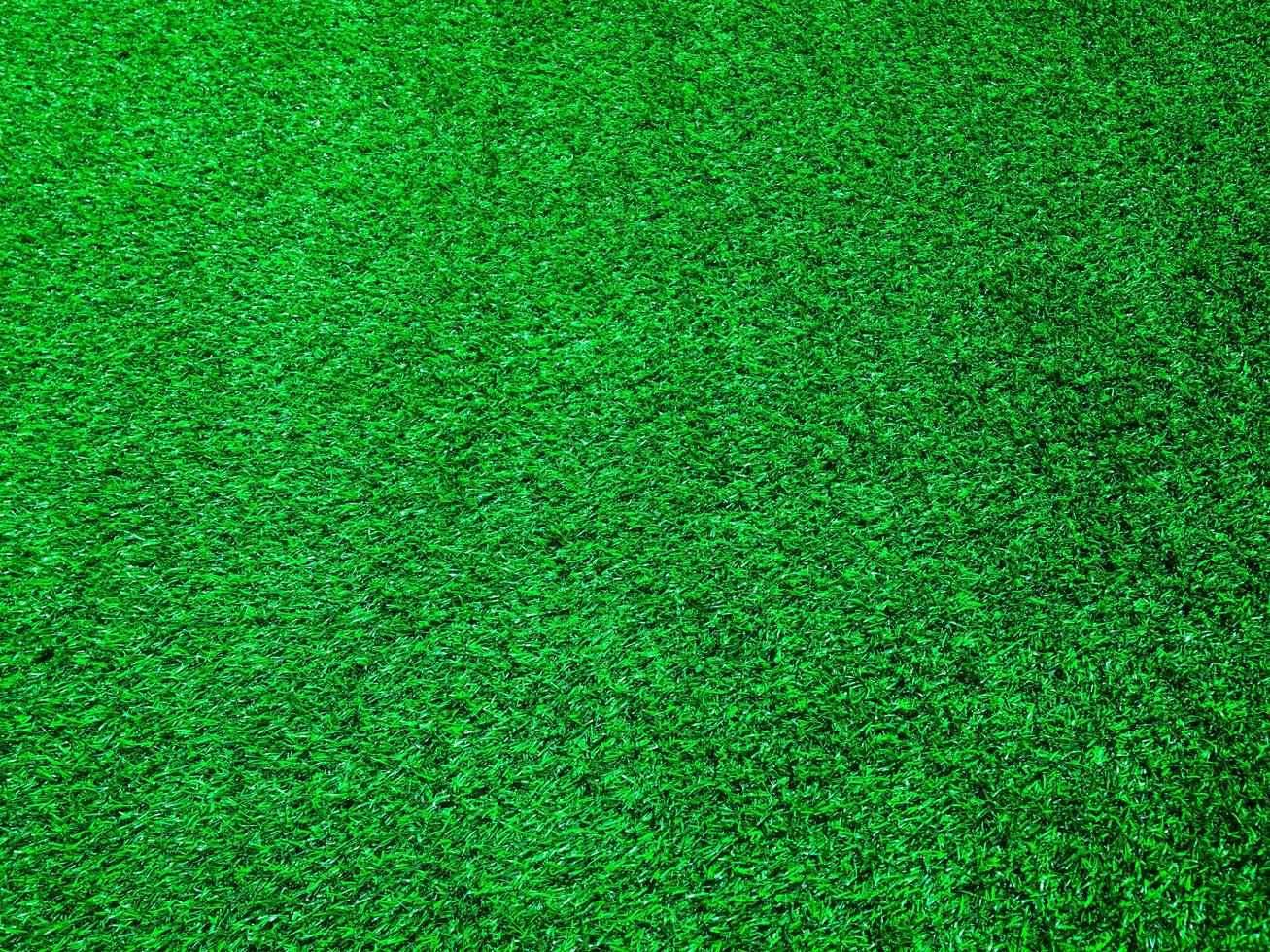 Artificial green lawn backyard for background. Texture for design photo