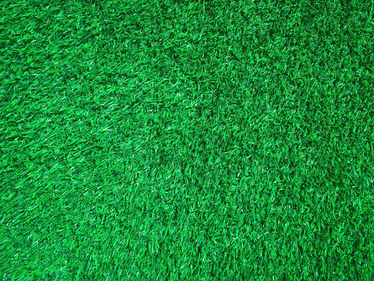Artificial green lawn backyard for background. Texture for design photo