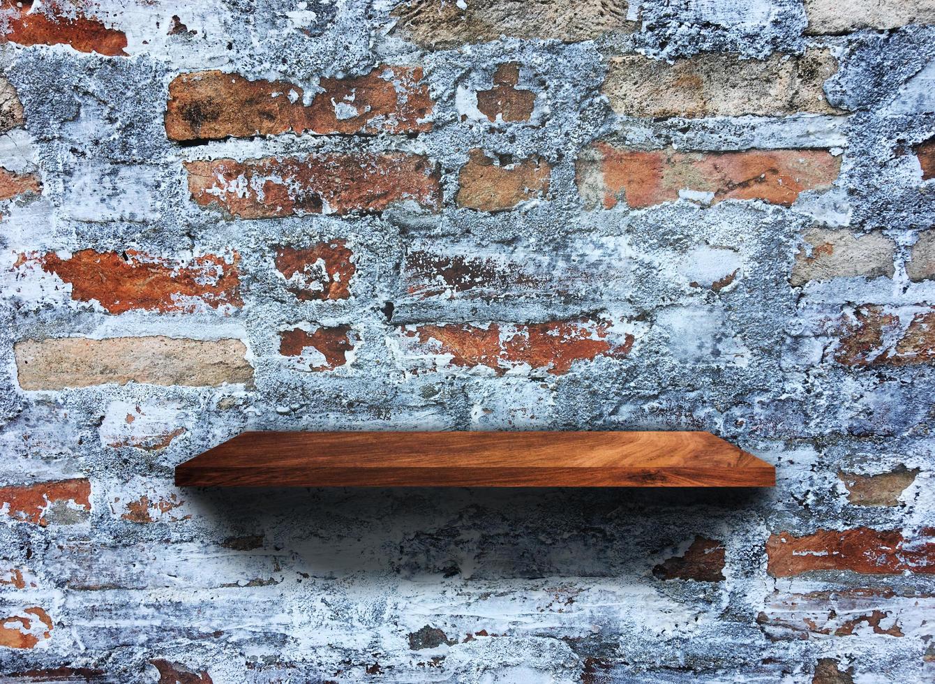 Rustic wooden shelf on grey concrete wall texture background with clipping path. pattern wallpaper photo