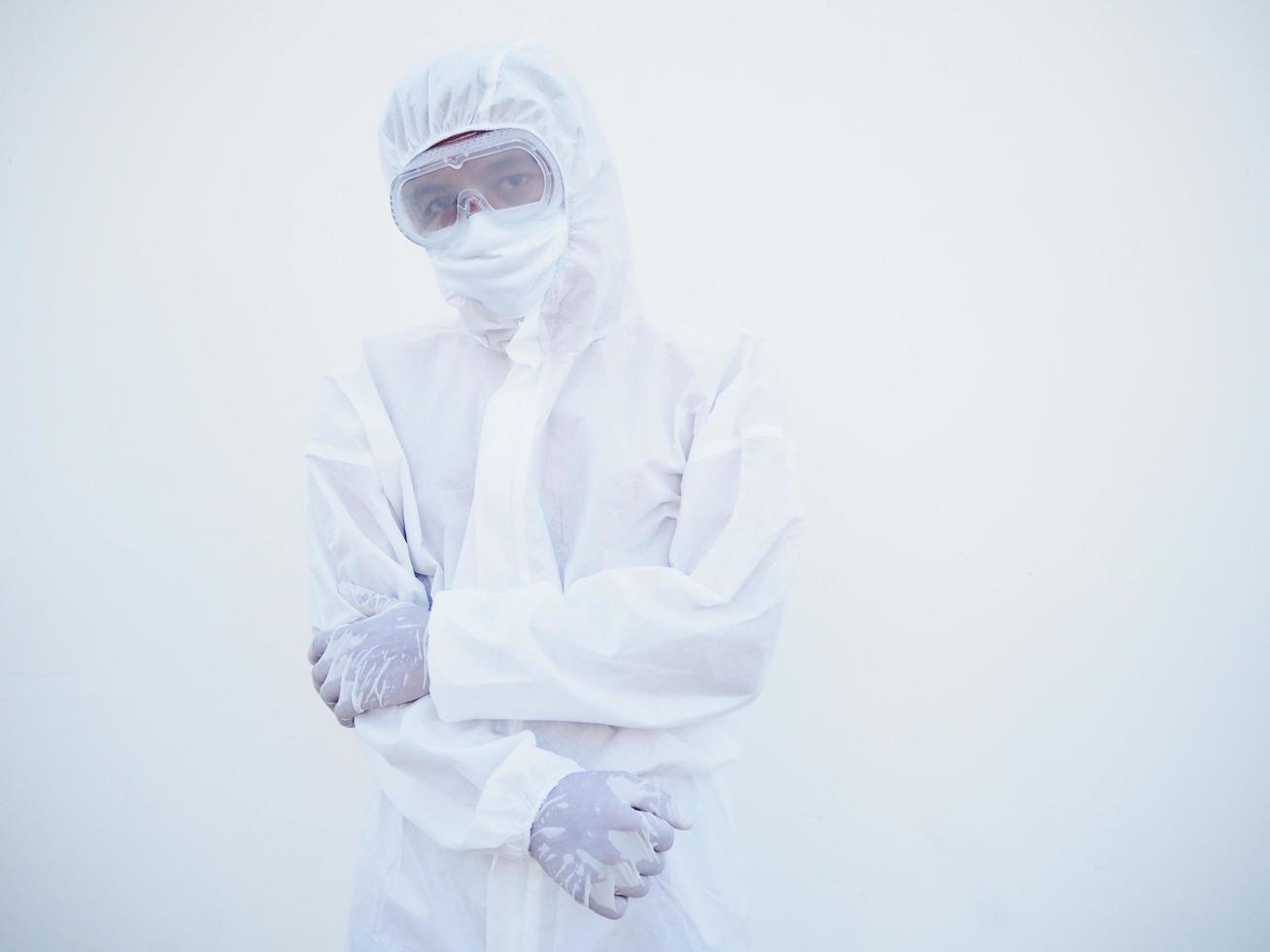 Portrait of confident asian male doctor or scientist in PPE suite uniform while folding his hands in the white background. coronavirus or COVID-19 concept. photo