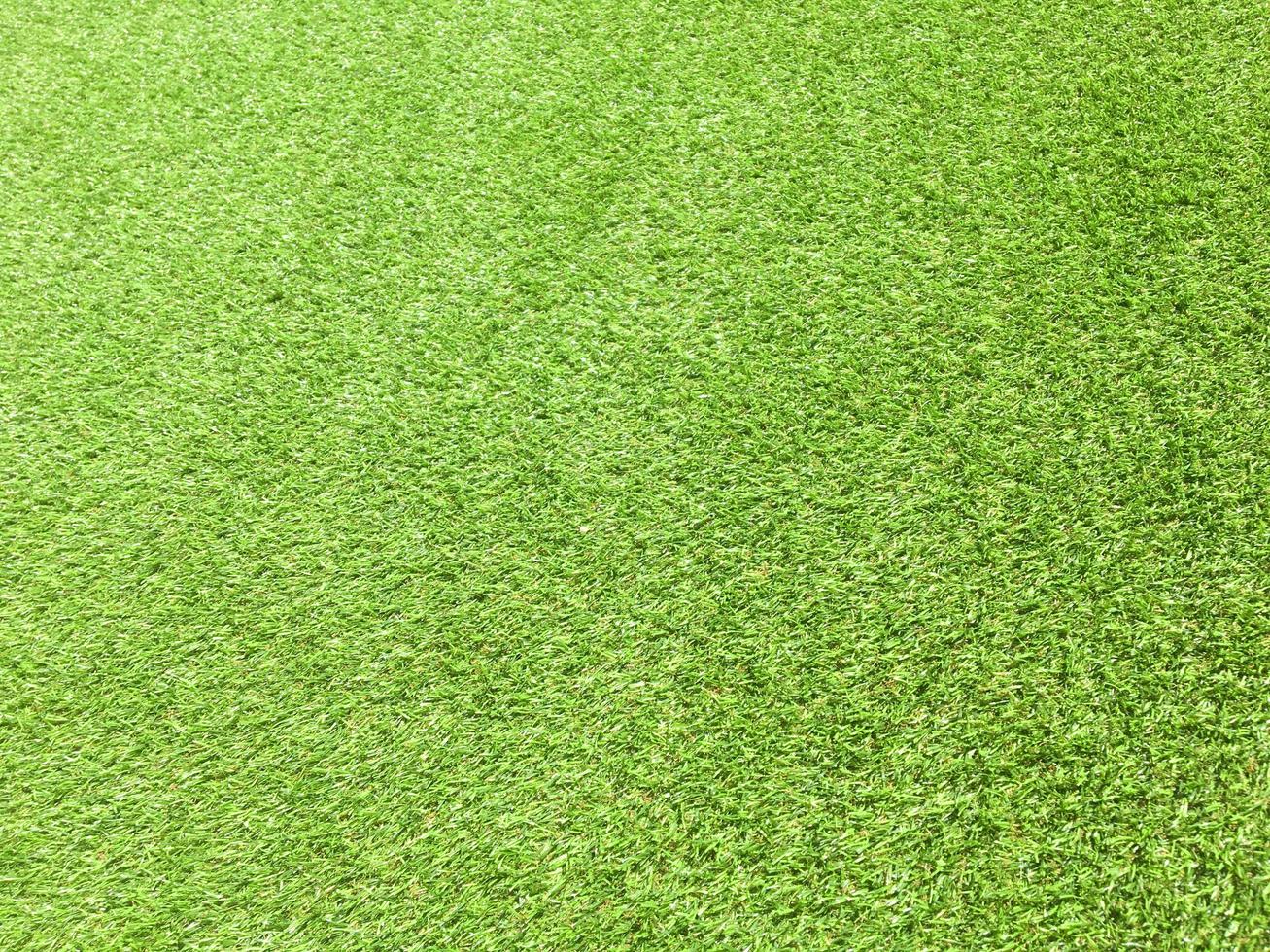 Artificial green lawn backyard for background. Texture for design photo
