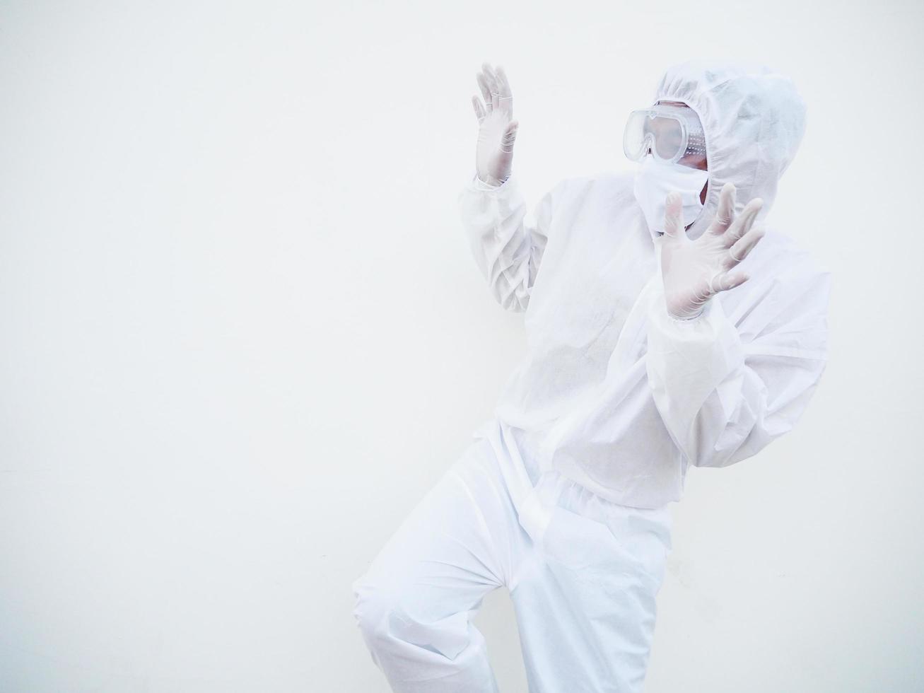 Asian doctor or scientist in PPE suite uniform showing has frightened expression as notices something terrible or scarying for text or design on a white background. coronavirus or COVID-19 concept photo