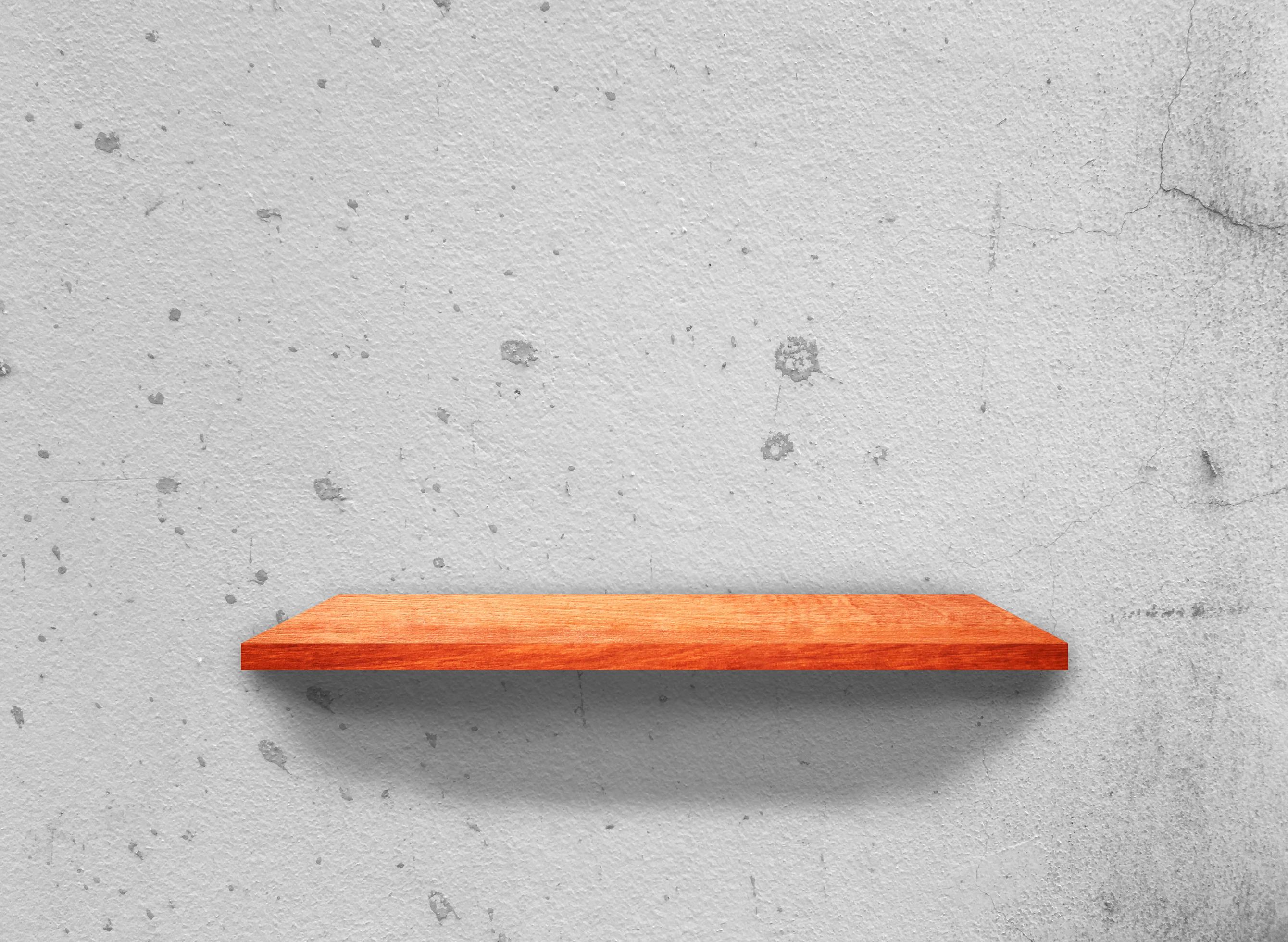 Vintage Wooden shelves on concrete wall texture background with