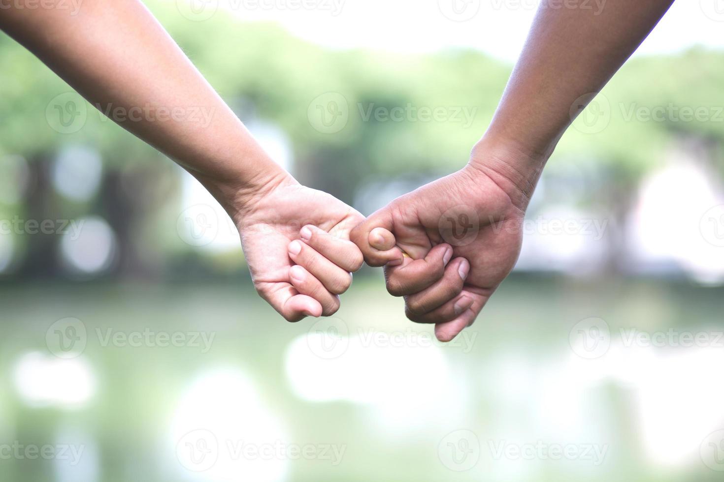 Woman and man holding hands, Happy couple holding hand in hand love in the parks. concept couple lover valentine day. photo