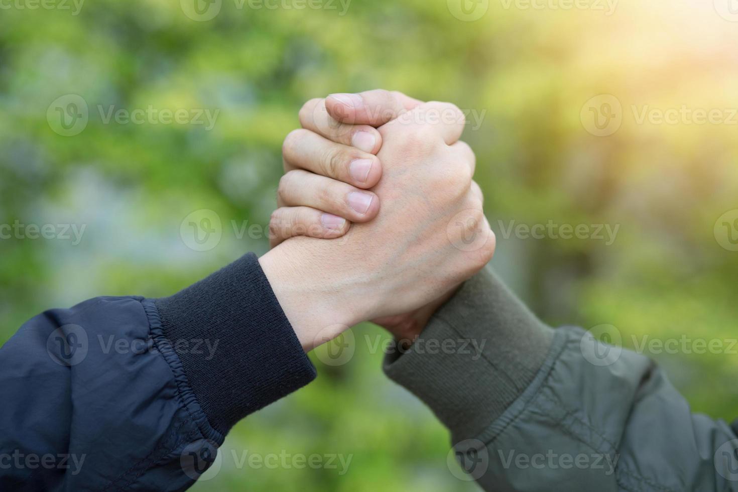 companionship  hand clasping success trust, confident concept. or Closeup of a business hand between two colleagues on parks. photo