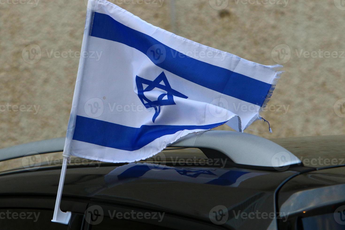 The blue and white flag of Israel with the six-pointed Star of David. photo