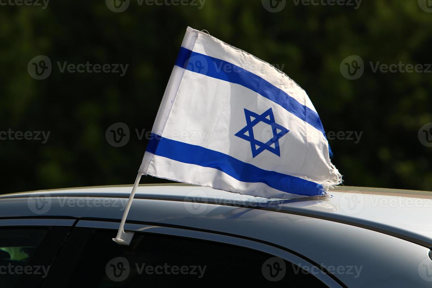 The blue and white flag of Israel with the six-pointed Star of David. photo