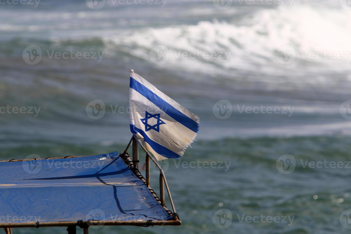 The blue and white flag of Israel with the six-pointed Star of David. photo