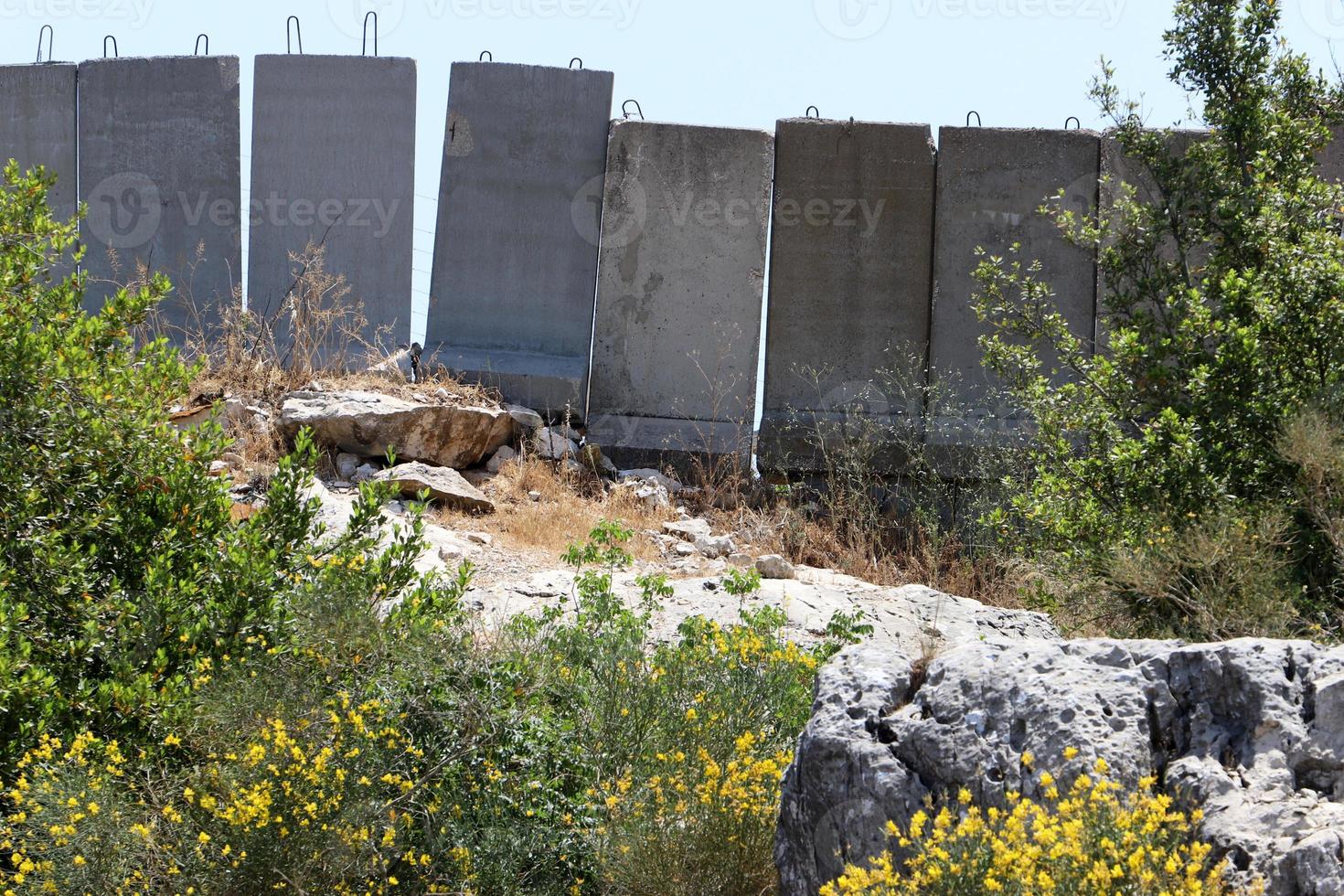 High wall made of stone and concrete. photo