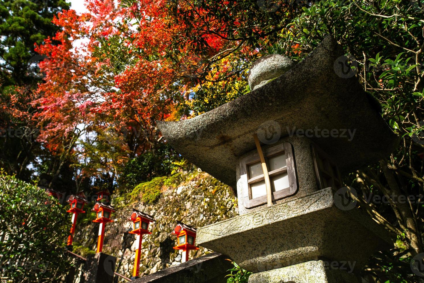 Autumn scene of Kurama-dera, a temple situated at the base of Mount Kurama in the far north of Kyoto Prefecture, Kansai, Japan photo