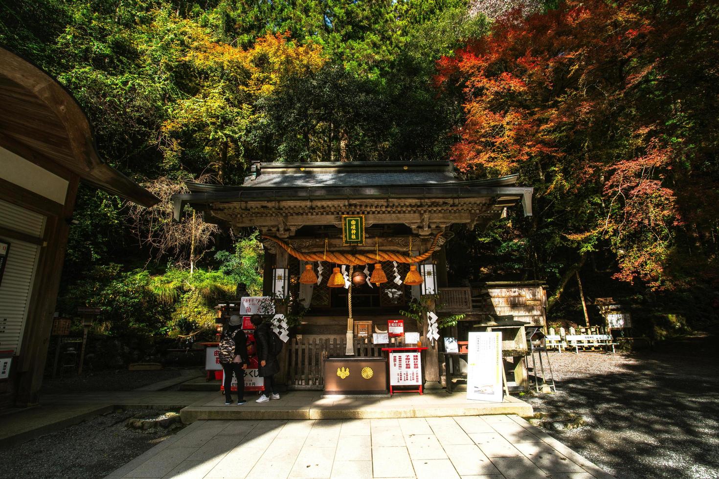 Kurama, Kyoto Prefecture, Kansai, Japan - November 21, 2019 - Tourists visit to Yuki-jinja, a famous Shinto shrine on the grounds of Kurama temple, situated at the base of Mount Kurama photo