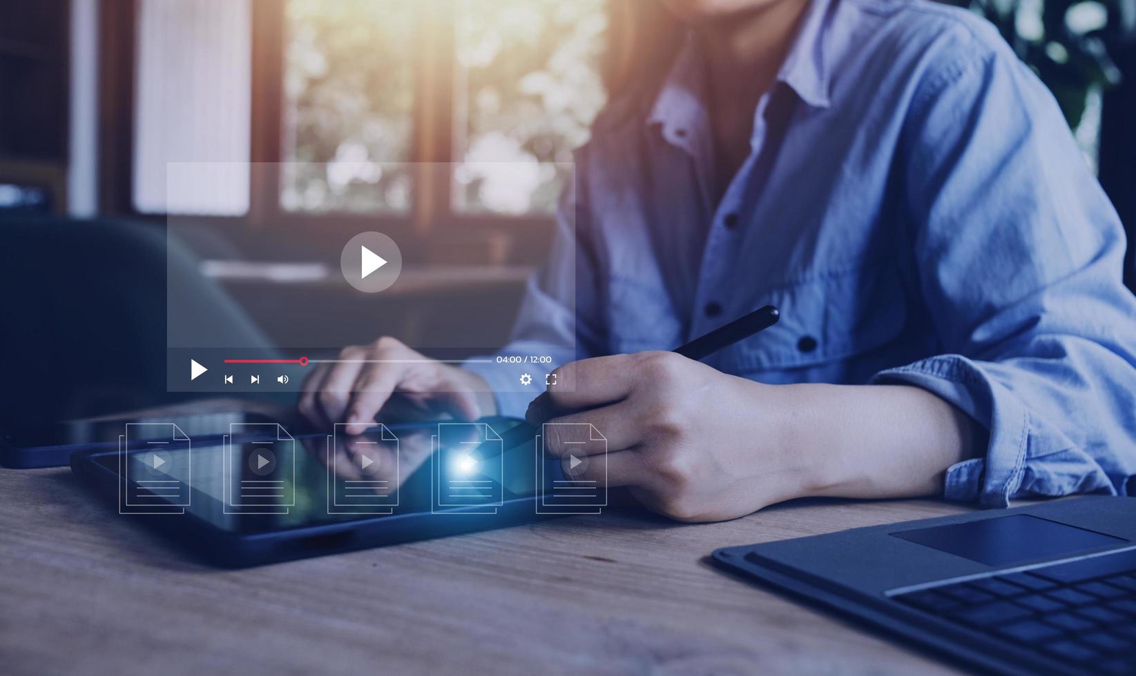 man using mouse and keyboard for streaming online, watching video on internet, live concert, show or tutorial photo