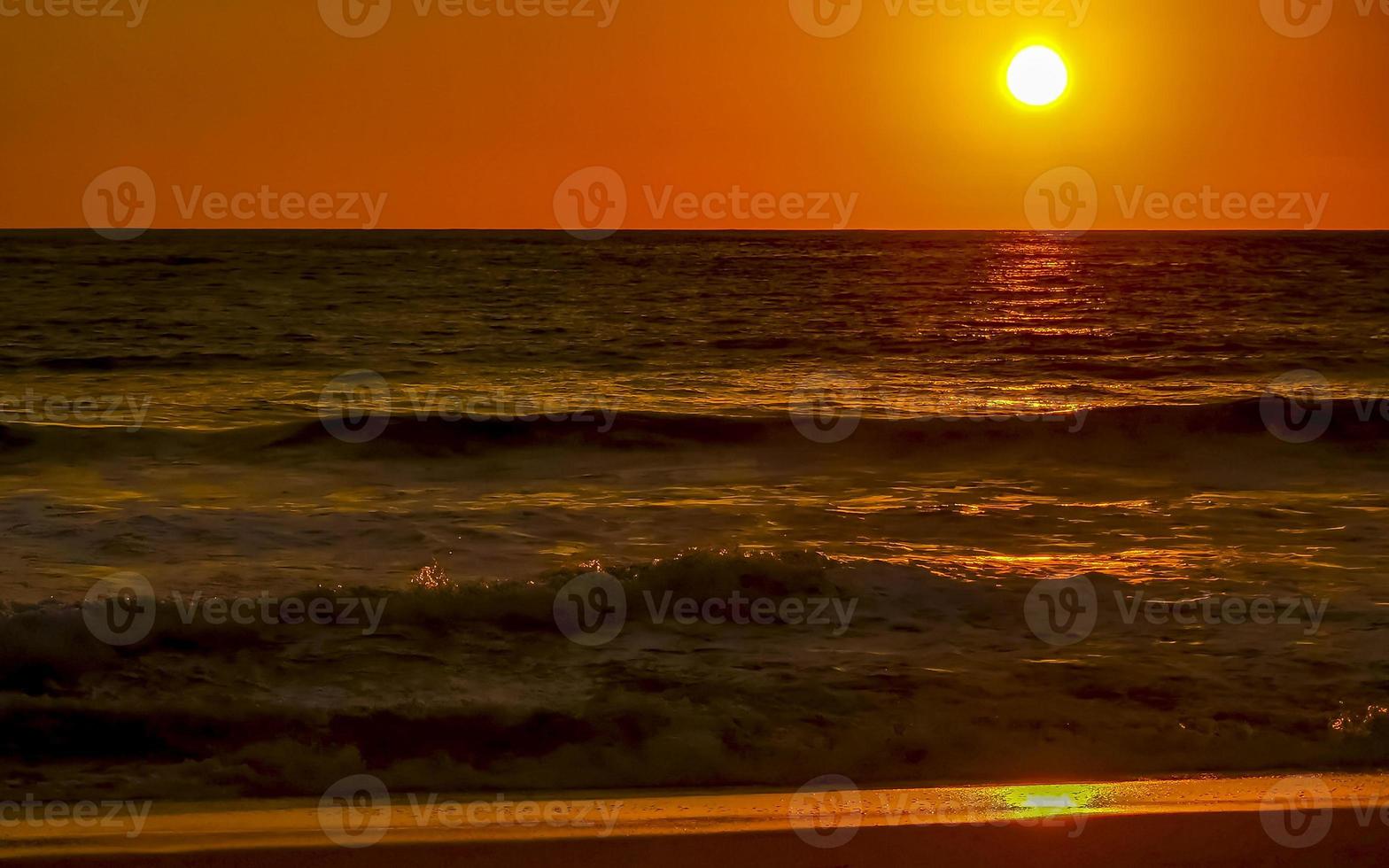 Colorful golden sunset big wave and beach Puerto Escondido Mexico. photo