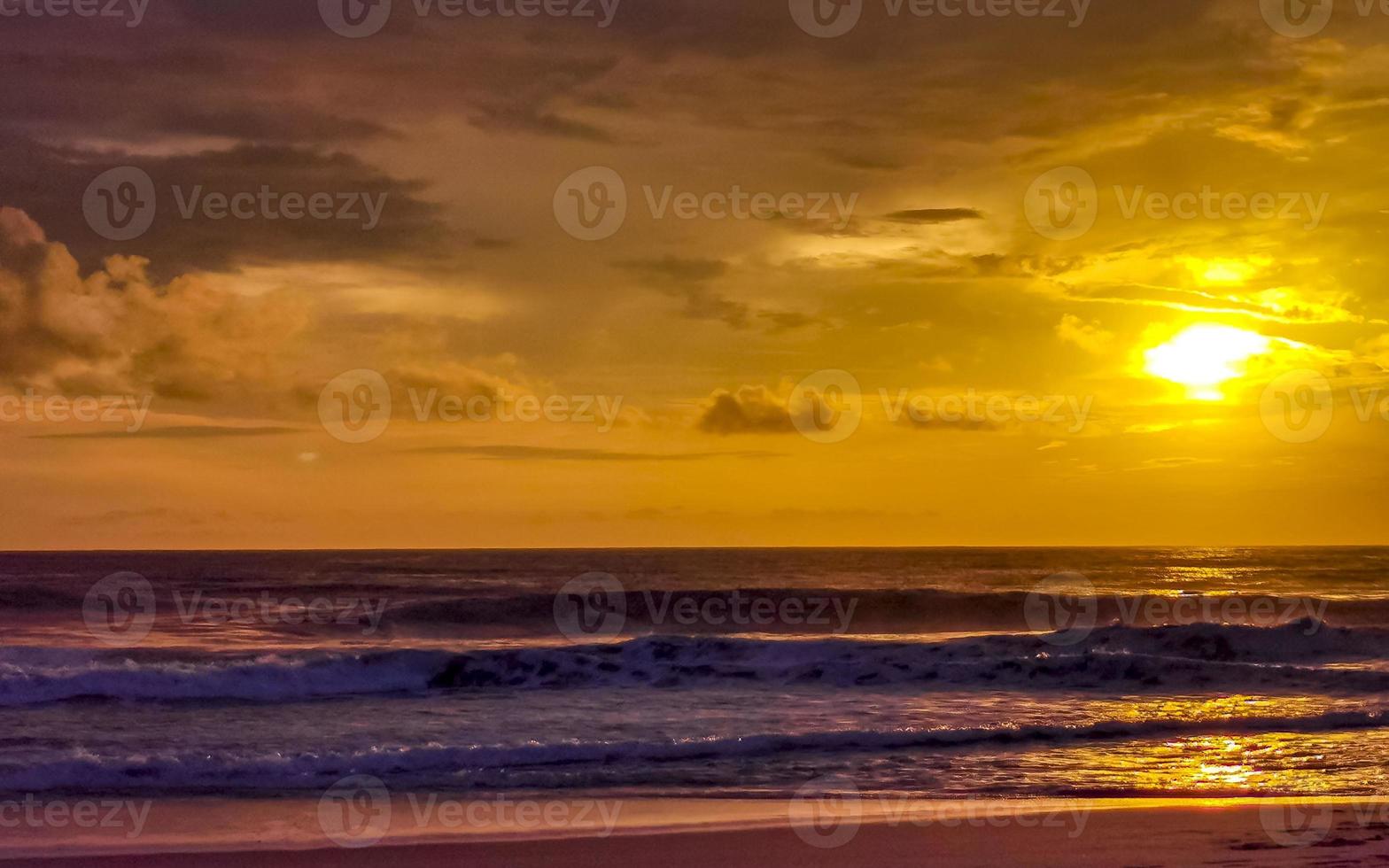 Colorful golden sunset big wave and beach Puerto Escondido Mexico. photo