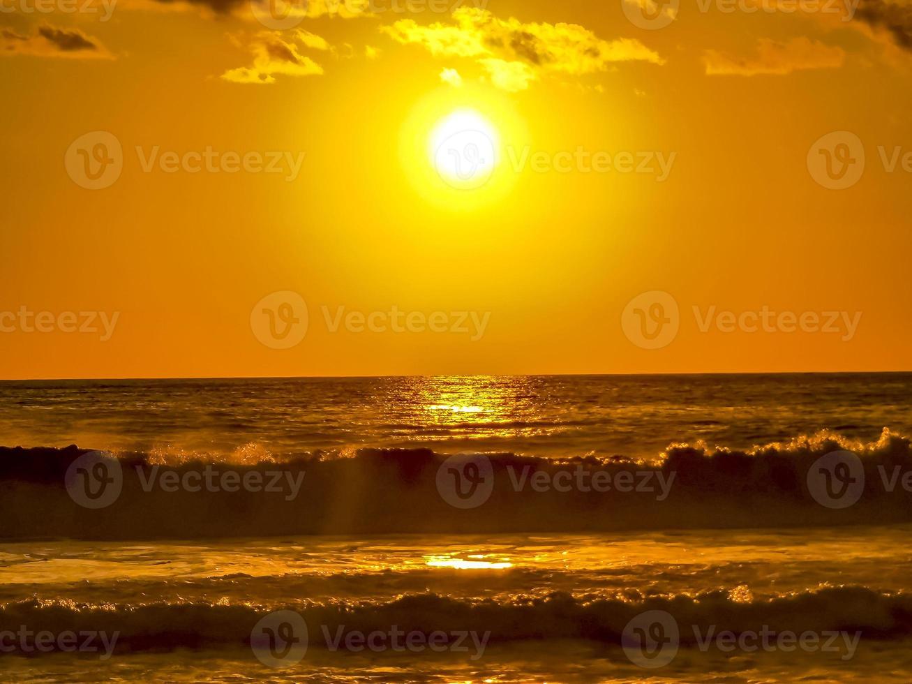 Colorful golden sunset big wave and beach Puerto Escondido Mexico. photo