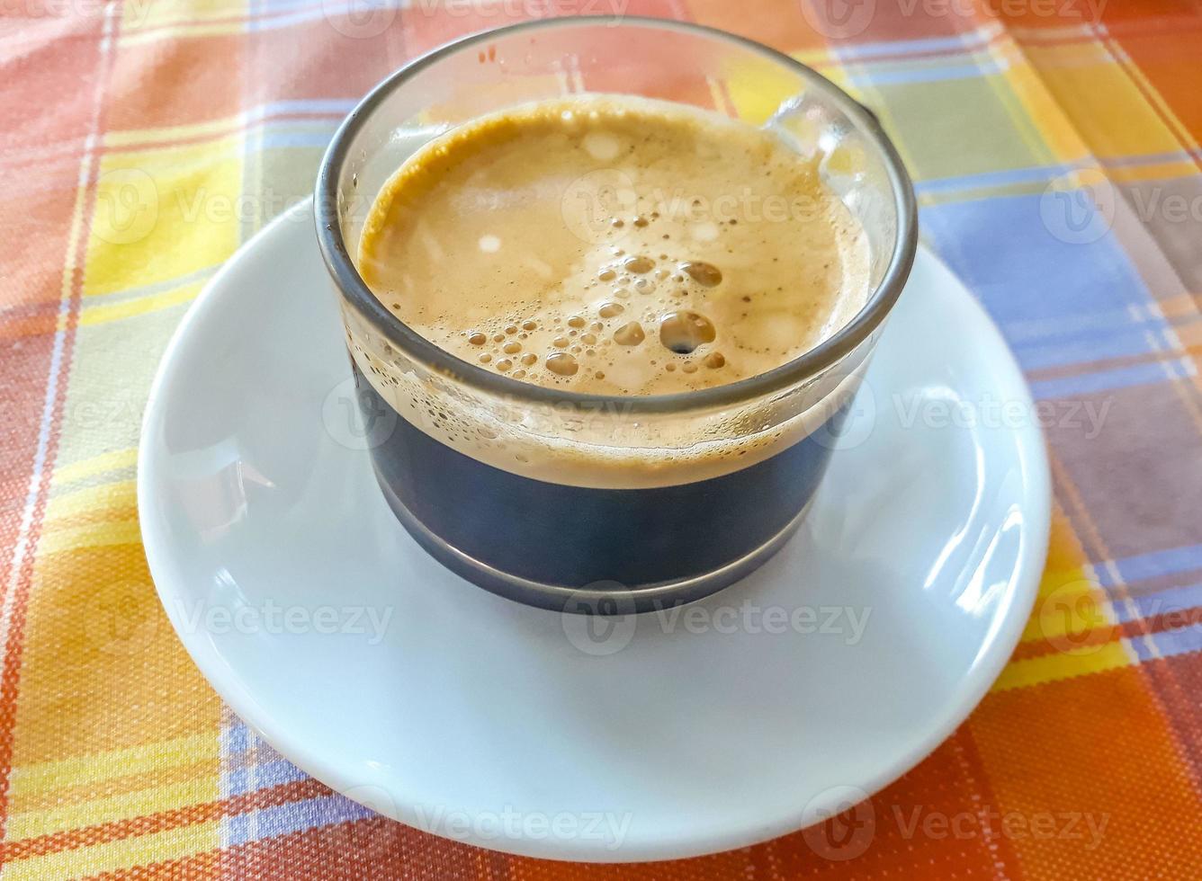 Glass Cup of black coffee in a restaurant Phuket Thailand. photo