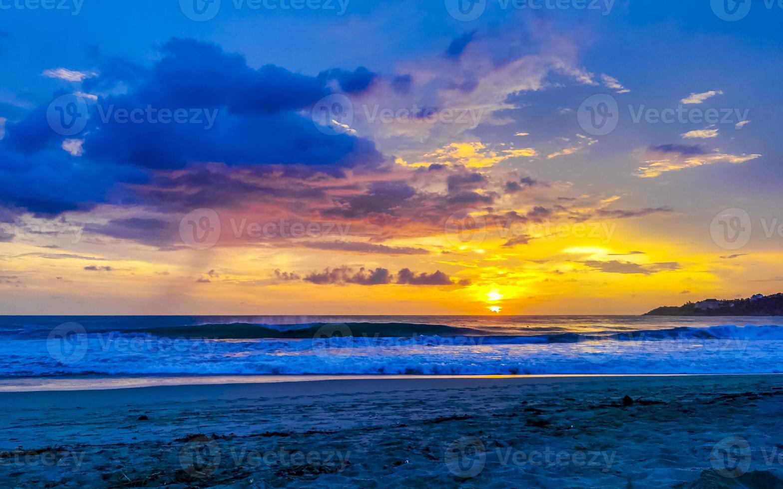 Colorful golden sunset big wave and beach Puerto Escondido Mexico. photo