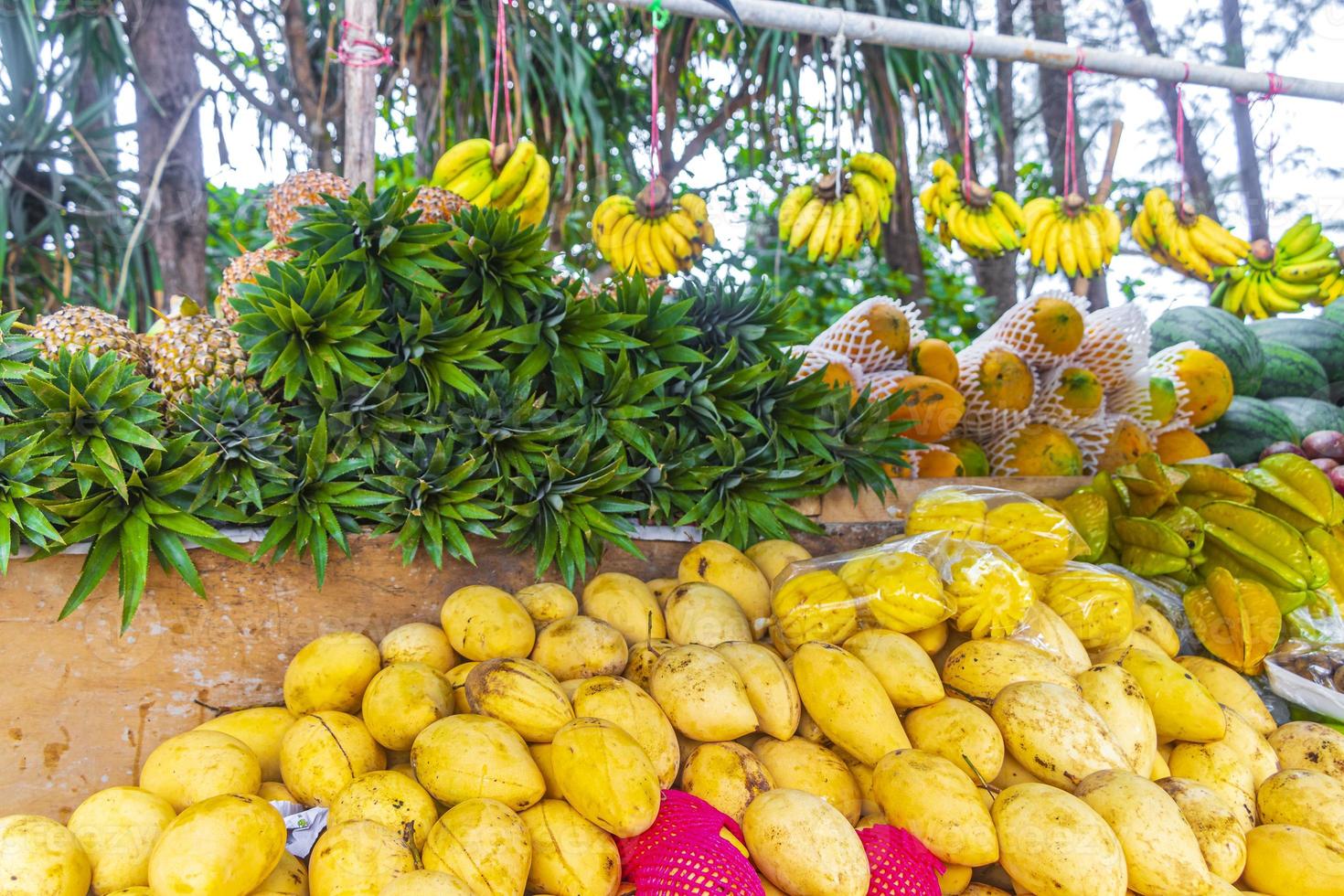 Mango pineapple bananas and watermelons in Thai market in Thailand. photo