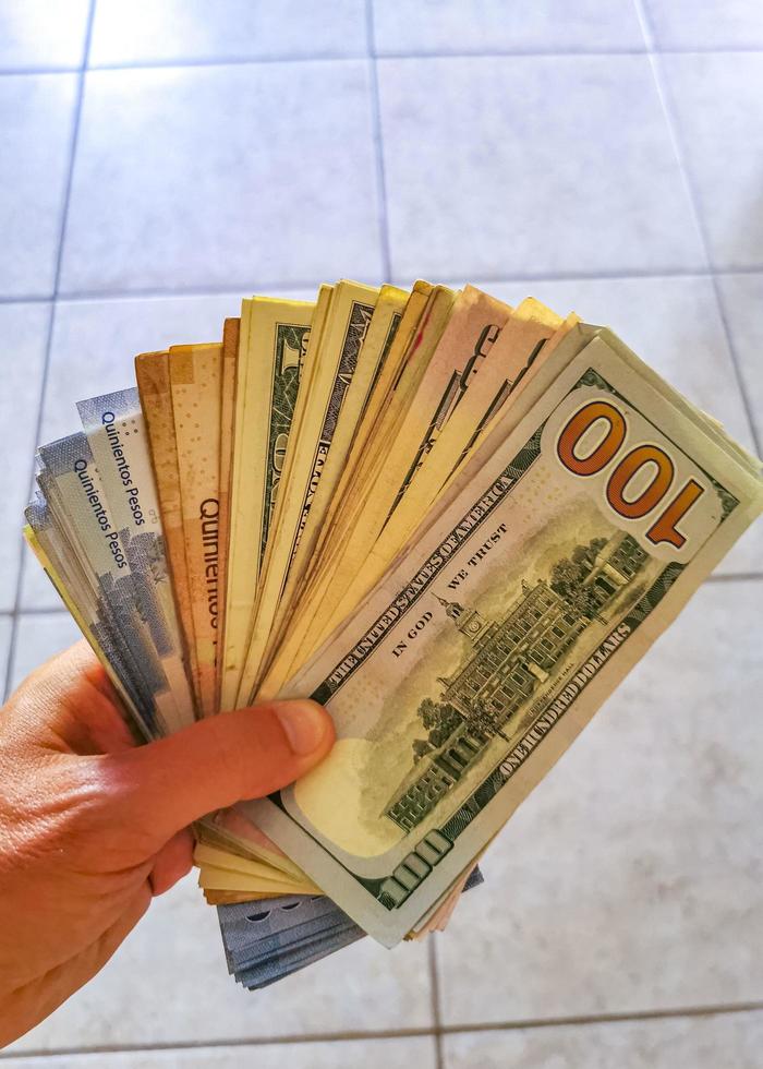 Playa del Carmen Quintana Roo Mexico 2022 US dollar banknotes in hand from the United States. photo