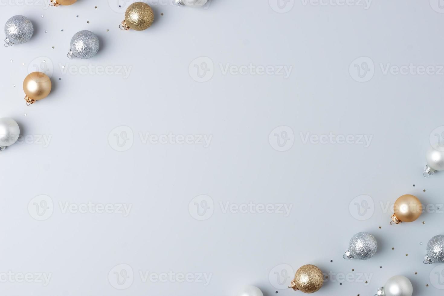 Christmas grey minimal background with grey and beige ball and confetti. Flat lay, copy space photo