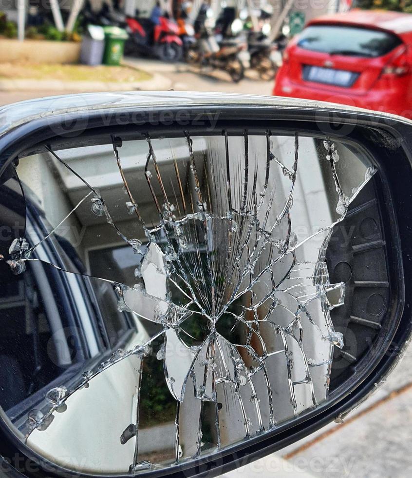 A car's right side rearview mirror was broken when it was hit by another vehicle photo