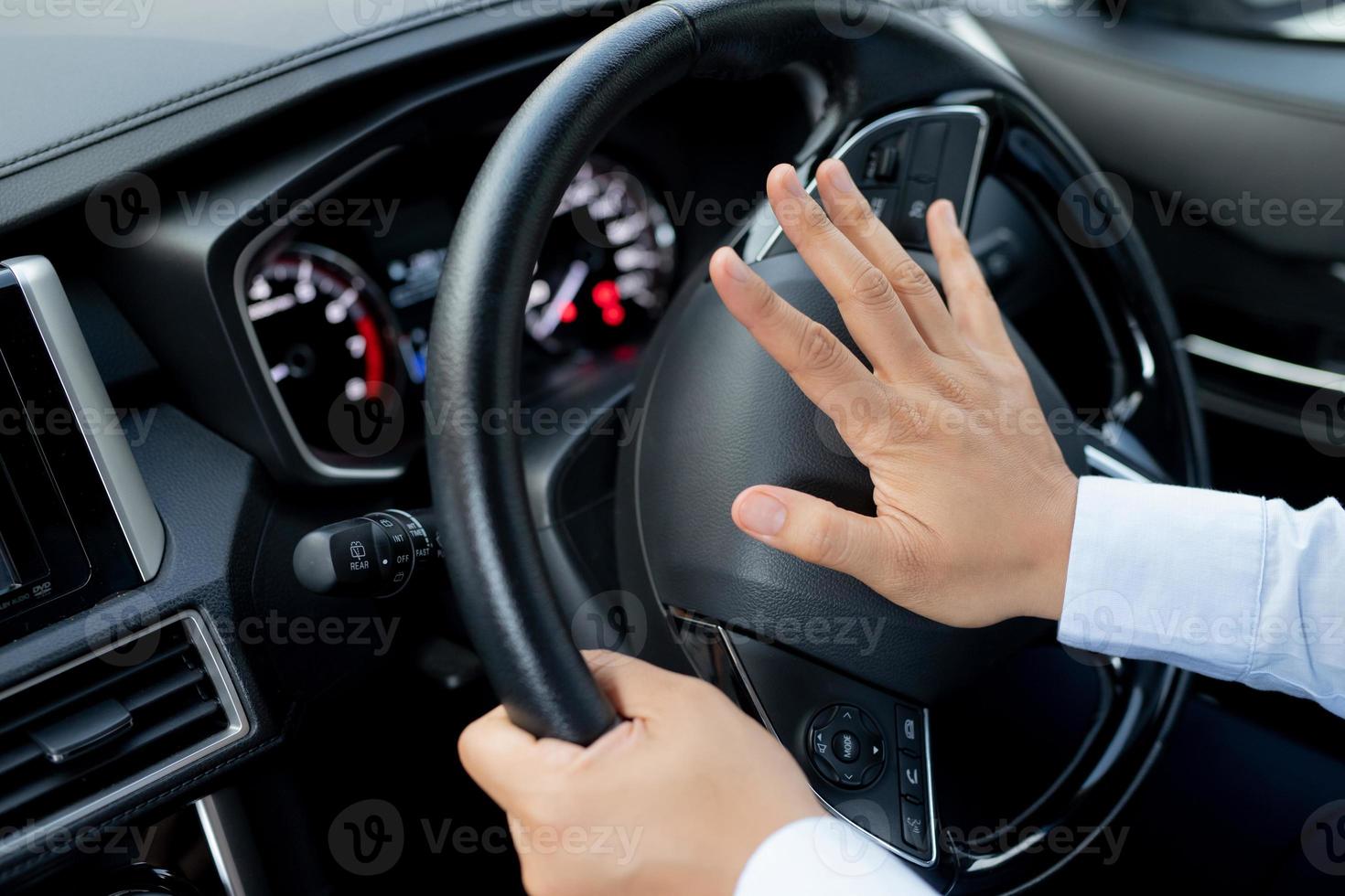 The driver is honking the horn to prevent an accident. photo