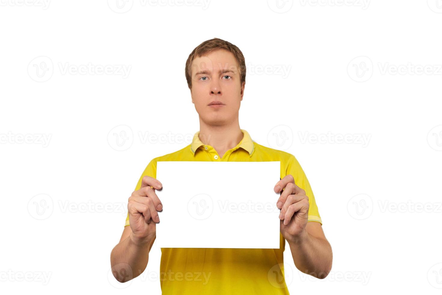 Serious nice guy holding blank paper sheet, paper mockup isolated on white background photo