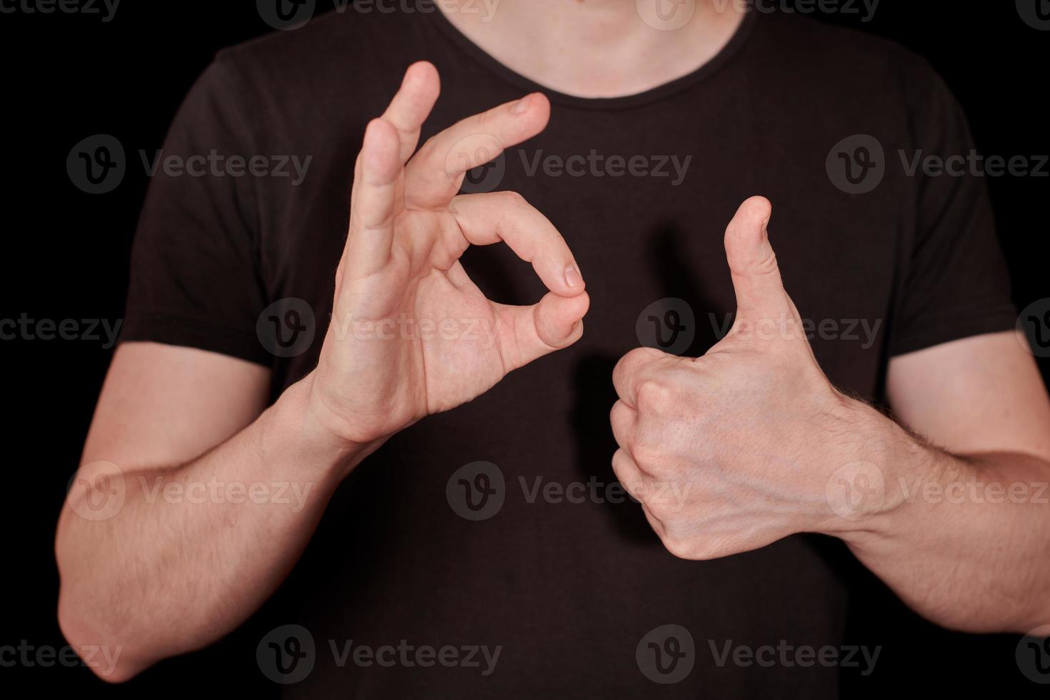 Thumbs up and OK signal man hand gesture photo