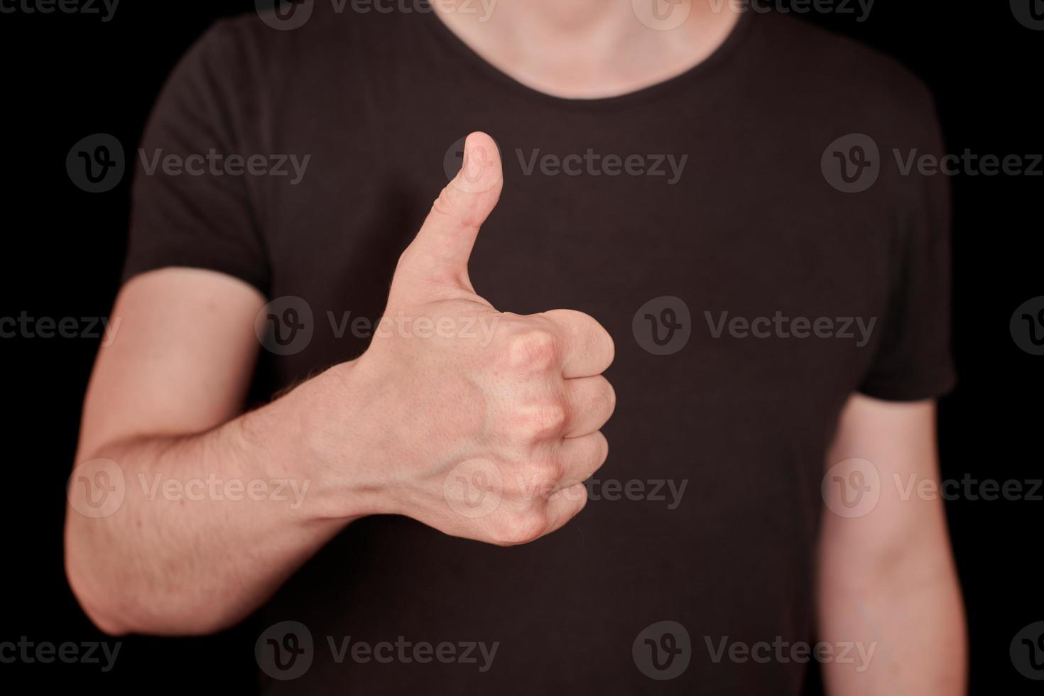 Thumbs up signal man hand gesture photo