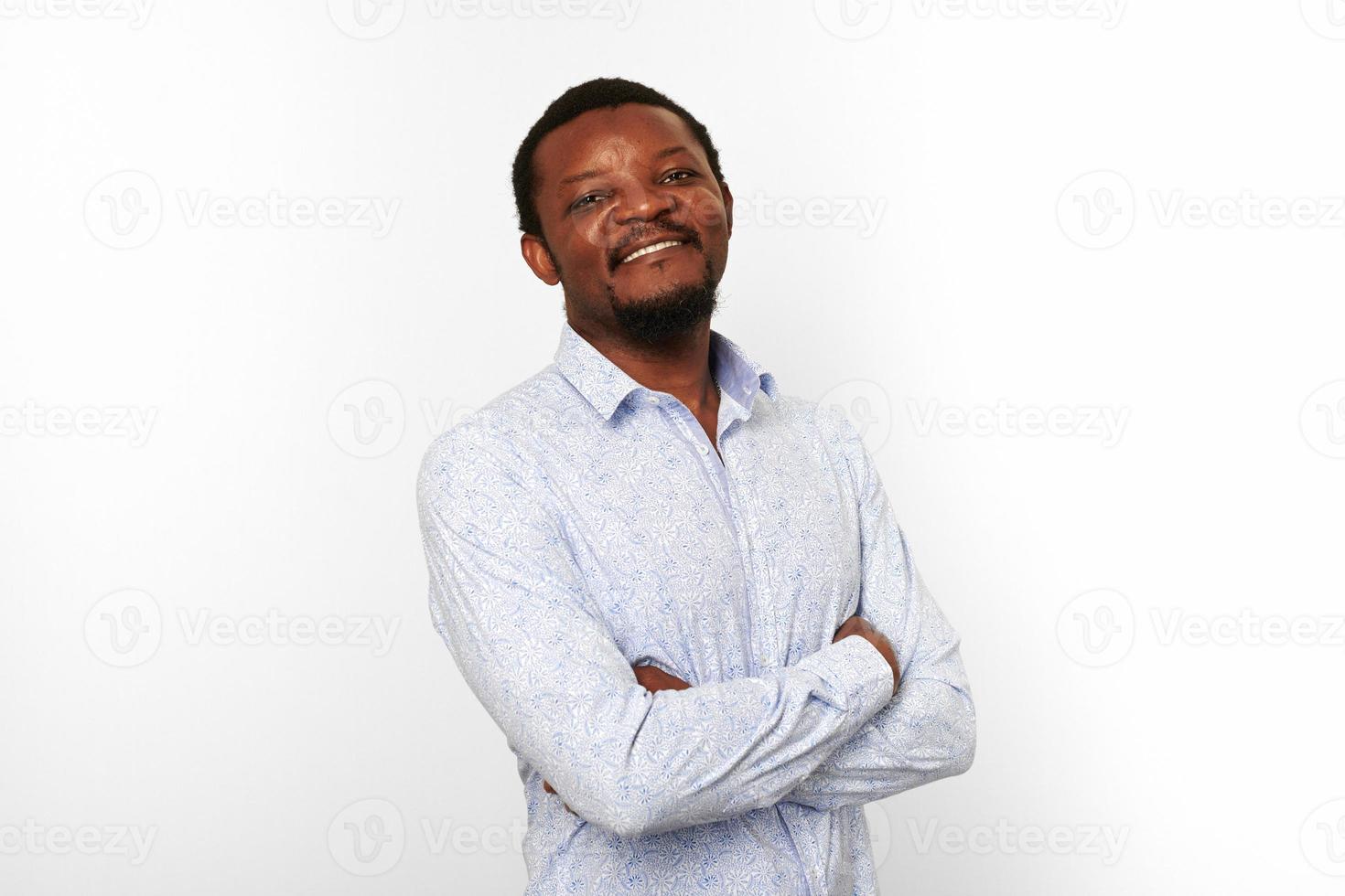Happy african american black man with crossed arms in casual bright shirt isolated white background photo